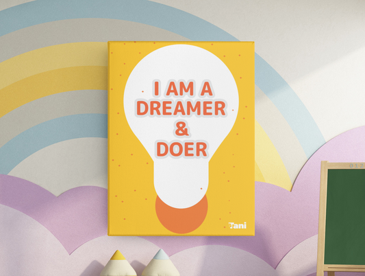 Canvas print with 'I am a dreamer & doer' text on a colorful wall with toys and a rainbow.